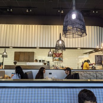 Summer Moon Coffee - people sitting at tables in a cafe - Coffee & Tea Near Me - El Paso, Texas