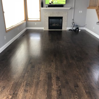Renewed Hardwood Floors - a living room with a flat screen tv - Flooring Near Me - Brooklyn Park, Minnesota Renewed Hardwood Floors - a living room with a flat screen tv - Flooring Near Me - Brooklyn Park, Minnesota