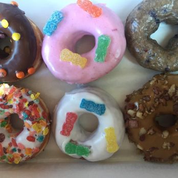Donut King - from top left to bottom right: reese's, sour patch, bluberry, frosted flakes, sour patch again, and maple bacon - Donuts Near Me - Winter Park, Florida Donut King - from top left to bottom right: reese's, sour patch, bluberry, frosted flakes, sour patch again, and maple bacon - Donuts Near Me - Winter Park, Florida