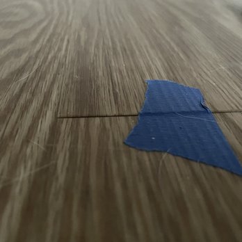 Luna Flooring - Another floor board that is starting to pop up at the edge - Carpet Installation Near Me