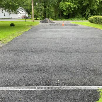 Nadeau Paving - a paved driveway in a residential neighborhood - General Contractors Near Me - Troy, New York