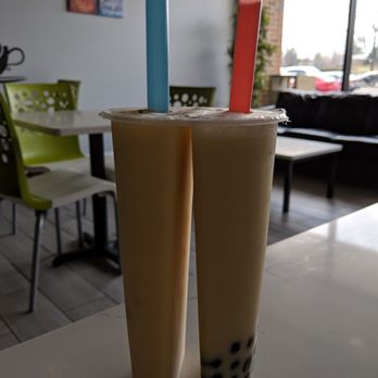 GraviTea - Moh-tea with mango boba with the blue straw and pineapple Jasmine green tea with regular boba with the red straw - Bubble Tea Near Me - Schaumburg, Illinois GraviTea - Moh-tea with mango boba with the blue straw and pineapple Jasmine green tea with regular boba with the red straw - Bubble Tea Near Me - Schaumburg, Illinois