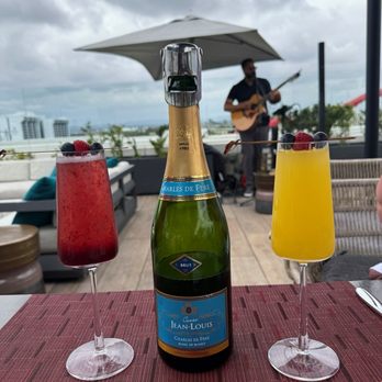 Rise Rooftop Lounge - Blueberry and Orange Mimosas. Order by the bottle for cart service all brunch. Live music by Roderick! - Lounges Near Me - Anaheim, California Rise Rooftop Lounge - Blueberry and Orange Mimosas. Order by the bottle for cart service all brunch. Live music by Roderick! - Lounges Near Me - Anaheim, California
