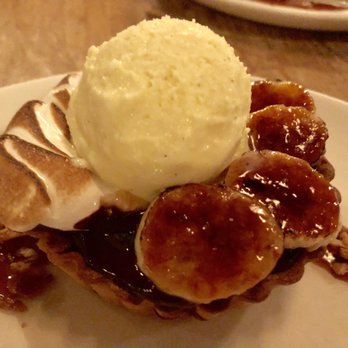 Monteverde - Warm Chocolate Ganache Tart with Hazelnut Praline, Banana Caramel, Vanilla Ice Cream - Italian Near Me - Chicago, Illinois Monteverde - Warm Chocolate Ganache Tart with Hazelnut Praline, Banana Caramel, Vanilla Ice Cream - Italian Near Me - Chicago, Illinois