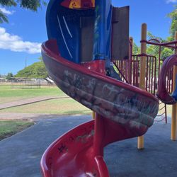 Waimalu Neighborhood Park - Playground Not in the best shape. The shade from the tree is nice at least.