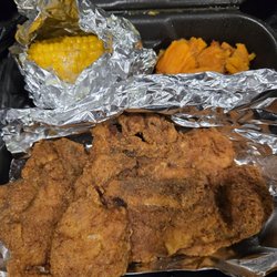 The Spot - Porkchop with yams and corn on the cob
