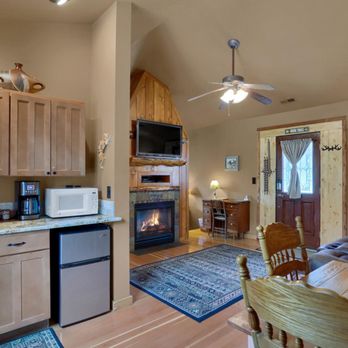 Rocky Mountain Lodge - Sitting room, dining area and kitchen area with mini fridge and freezer, coffeemaker and microwave - Vacation Rentals Near Me - Cascade, Colorado