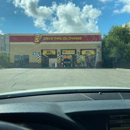 Exterior outside entrance of Take 5 Oil Change - 2 open bays and no employees working. - Houston, Texas Exterior outside entrance of Take 5 Oil Change - 2 open bays and no employees working. - Houston, Texas