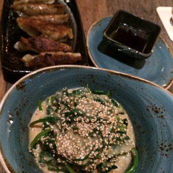 Kenibo Ramen-Bar - Burnt gyozas and spinach salad swimming in dressing. - Ramen Near Me - Hanover, NI