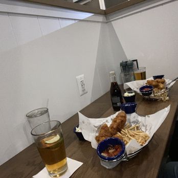 Ford’s Fish Shack - It's a cubby hole they call a "Table for Two".  Pathetic, unless your idea of a night out is looking at a wall 2 feet in front of your face. - Seafood Near Me - Chantilly, Virginia