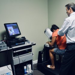 Dominion Family Chiropractic - Dr. Stewart using the Pro-Adjuster on a patient.