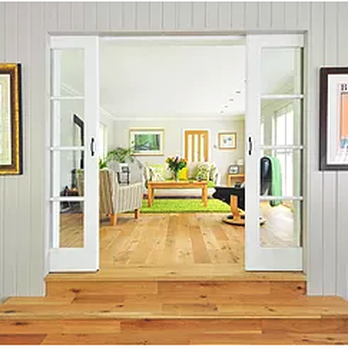 Alpha Constructions & Renovations - a view of a living room through a door - General Contractors Near Me