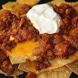 Let's Go Mexican Food - Chili nachos: home made doritos topped with melted cheese and chili.