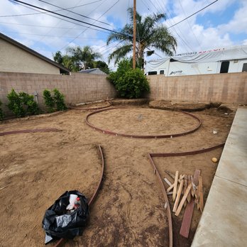 JJL Landscaping - Framing of circular garden and dry creek. - Landscaping Near Me JJL Landscaping - Framing of circular garden and dry creek. - Landscaping Near Me