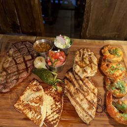 New York strip cheese and grilled vegetables, grilled chicken and grilled shrimp New York strip cheese and grilled vegetables, grilled chicken and grilled shrimp