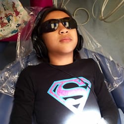 Rene Alingog, DDS - My little Supergirl's first visit. Enjoying the cool shades while watching the ceiling television.