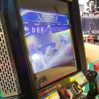 Chuck E. Cheese - a man playing a video game - Pizza Near Me - Irving, Texas Chuck E. Cheese - a man playing a video game - Pizza Near Me - Irving, Texas