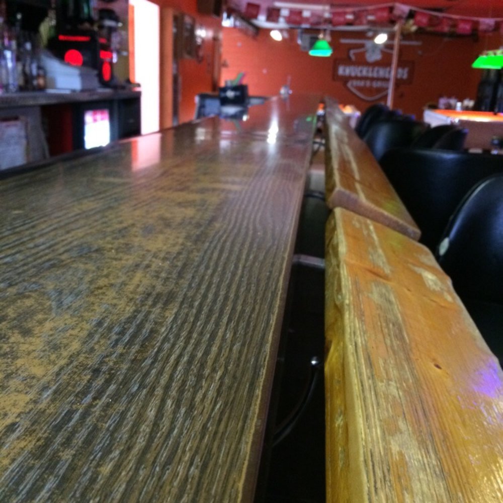 Knuckleheads Bar & Grill - a wooden bar top - Bars Near Me - Hill City, Minnesota Knuckleheads Bar & Grill - a wooden bar top - Bars Near Me - Hill City, Minnesota