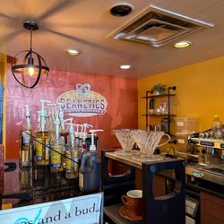 Beanetics Coffee Roasters - A view of the cafe service counter and selection of syrups