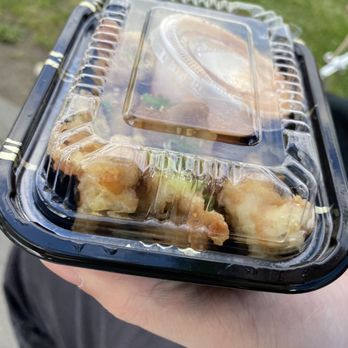 Ginger Sushi - a person holding a plastic container of food - Sushi Bars Near Me - Vancouver, British Columbia Ginger Sushi - a person holding a plastic container of food - Sushi Bars Near Me - Vancouver, British Columbia