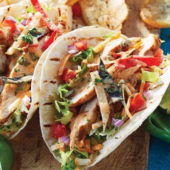 Montana's - two chicken tacos on a cutting board - Steakhouses Near Me - Saskatoon, Saskatchewan Montana's - two chicken tacos on a cutting board - Steakhouses Near Me - Saskatoon, Saskatchewan