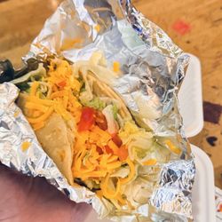 Hamburger Taco with "tomatoes", lettuce, cheese.