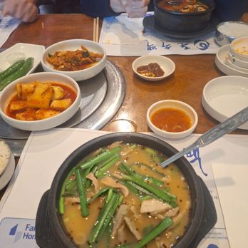 Don Soo Baek - The Doeji Gook Bab - Pork soup with rice on the side. Comes with chives, minced peppers, dadaegi (red pepper paste), and shrimp sauce - Korean Near Me - Duluth, Georgia