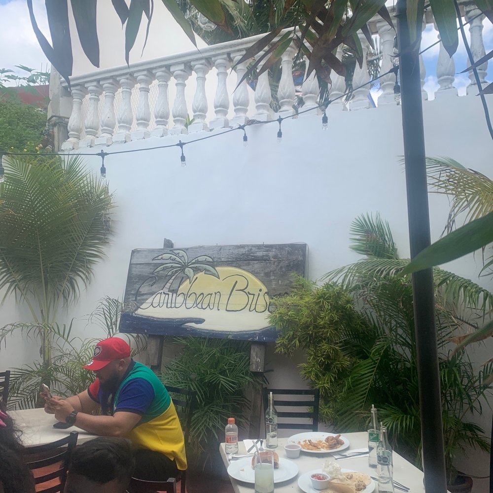 Caribbean Brisas - The sign and couple tables - Seafood Near Me - Isla Mujeres, ROO Caribbean Brisas - The sign and couple tables - Seafood Near Me - Isla Mujeres, ROO