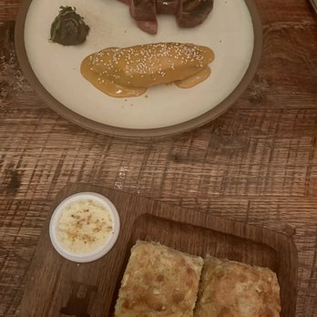 Husk - Duck entree and butter biscuits - Southern Near Me - Nashville, Tennessee Husk - Duck entree and butter biscuits - Southern Near Me - Nashville, Tennessee