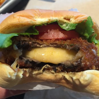 Shake Shack Tysons Corner - The cheese oozing from my Shroom burger - Burgers Near Me - McLean, Virginia Shake Shack Tysons Corner - The cheese oozing from my Shroom burger - Burgers Near Me - McLean, Virginia