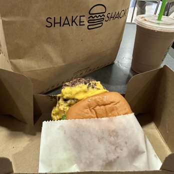 Shake Shack - The burger is laying on the cardboard. - Fast Food Near Me - Dallas, Texas Shake Shack - The burger is laying on the cardboard. - Fast Food Near Me - Dallas, Texas