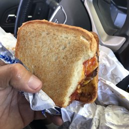 The grilled cheese double burger with the bread ripped. The grilled cheese double burger with the bread ripped.