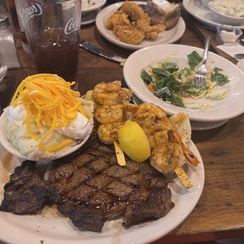 Texas Roadhouse - 12oz ribeye? And shrimp. She meant to order loaded baked potato but she actually said loaded mashed and was happy with her mistake - Steakhouses Near Me - Indio, California