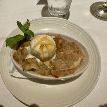 Carrabba's Italian Grill - Caramel apple crumble with scoop of vanilla ice cream - Italian Near Me - Collierville, Tennessee Carrabba's Italian Grill - Caramel apple crumble with scoop of vanilla ice cream - Italian Near Me - Collierville, Tennessee