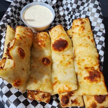 Paizano's Pizza - Giant cheesy breadsticks with side of ranch - Pizza Near Me - Baker City, Oregon Paizano's Pizza - Giant cheesy breadsticks with side of ranch - Pizza Near Me - Baker City, Oregon