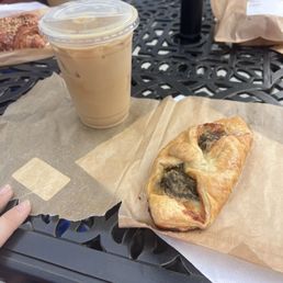 Artichoke pastry and oat milk latte Artichoke pastry and oat milk latte
