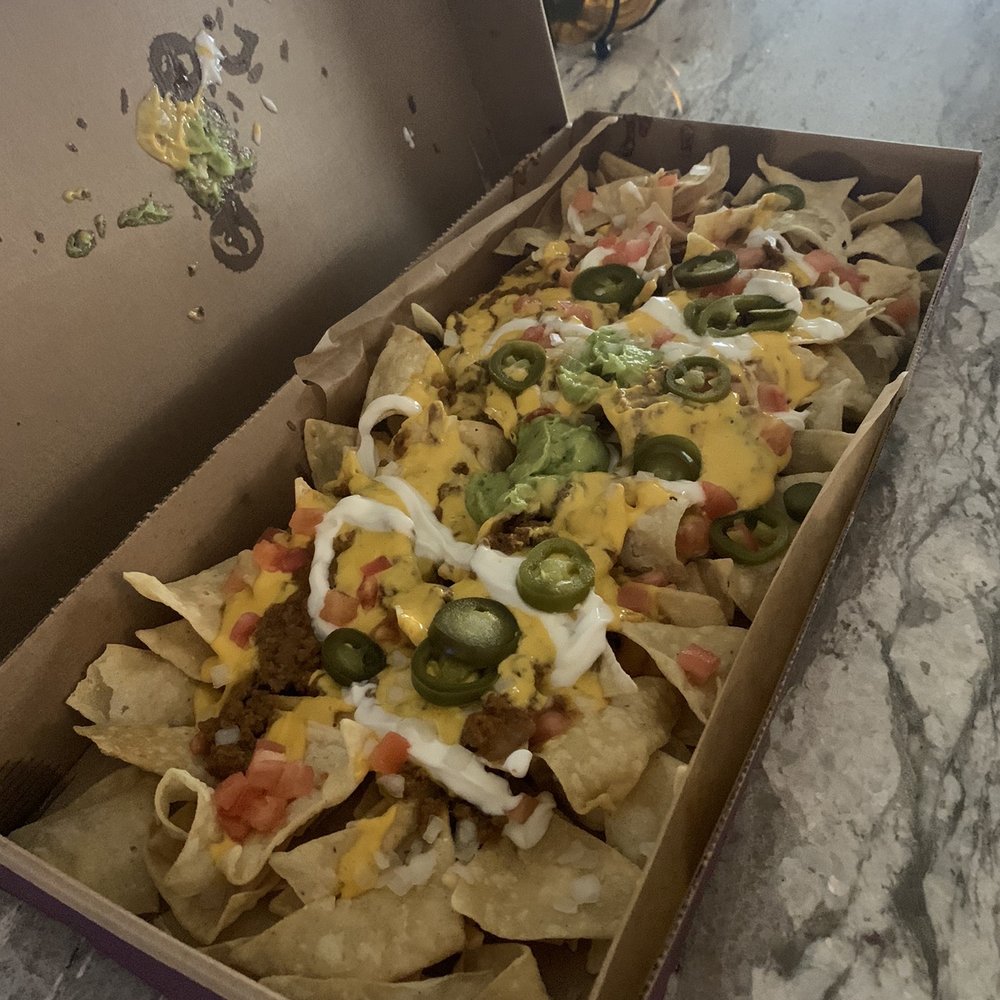 Taco Bell - How the party pack nachos actually look. They were delicious, but definitely need more stuff spread out. I even asked for extra cheese. - Mexican Near Me - Dripping Springs, Texas Taco Bell - How the party pack nachos actually look. They were delicious, but definitely need more stuff spread out. I even asked for extra cheese. - Mexican Near Me - Dripping Springs, Texas