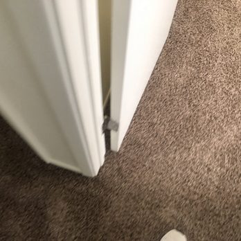 One Above Legacy - a pair of white shoes on the floor - Handyman Near Me
