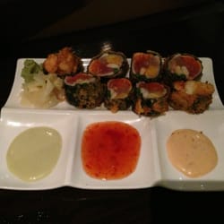 "Asian Gun" house special roll. Tuna, whitefish, salmon, crab, shrimp, asparagus, and what a beautiful presentation.