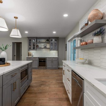 Kreative Resources - a kitchen with white countertops and gray cabinets - General Contractors Near Me - Altamonte Springs, Florida Kreative Resources - a kitchen with white countertops and gray cabinets - General Contractors Near Me - Altamonte Springs, Florida