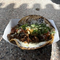 Crazy Coyote Tacos - GIANT TACO!!! Grilled beef steak, guacamole, cheese, cilantro, onions and their spicy red salsa. Thick hand made corn tortilla.