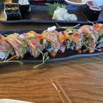 Sushi Den - New Style Salmon Roll - Japanese Near Me - Denver, Colorado Sushi Den - New Style Salmon Roll - Japanese Near Me - Denver, Colorado
