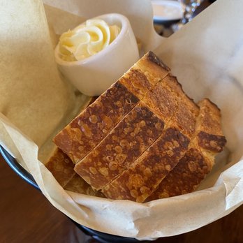 Bistro Boudin - Complimentary sourdough bread slices with butter - Bakeries Near Me - San Francisco, California