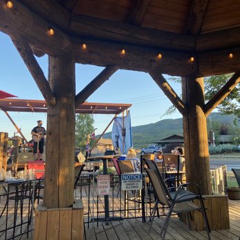 Saddlebag Saloon - a man sitting at a table under an umbrella - Bars Near Me - Eden, Utah Saddlebag Saloon - a man sitting at a table under an umbrella - Bars Near Me - Eden, Utah