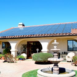 Green Convergence - Master Tile Installation. Panels are nearly flush with the tile roof and the conduit is hidden!