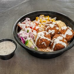 Bellanista Cafe & Restaurant - Falafel Tabaq (rice bowl with falafel, hummus and salad-- topped with our Mazaa sauce)