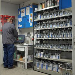 Quimbys Collision Center - paint room with factory-grade paint, mixing station, and color matching systems