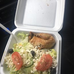 a salad in a styrofoam container