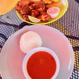 White rice, pinto beans (stew) fried breadfruit (tostones) & chicken wings. White rice, pinto beans (stew) fried breadfruit (tostones) & chicken wings.