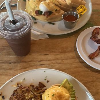 Swami's Café Oceanside - Eggs Benedict with avocado, extra crispy hash brown for me. Waffle Benedict, my friend's order. - Breakfast & Brunch Near Me - Oceanside, California